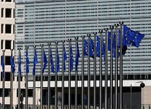 European Commission building with EU flags